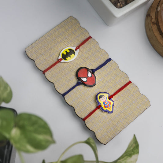 Adorable cartoon character Rakhi for boys featuring Batman, Spiderman Superman